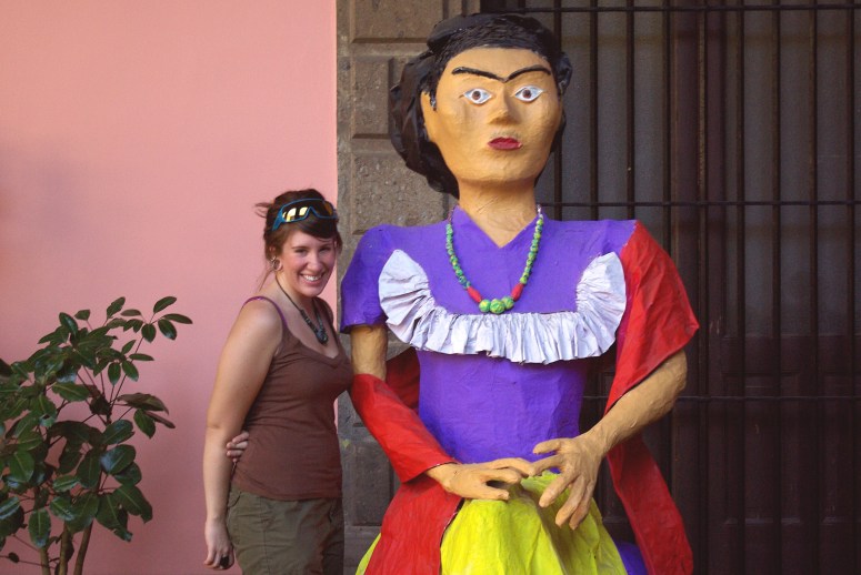 Me in Mexico City in front of a very large statue of Frida Kahlo.